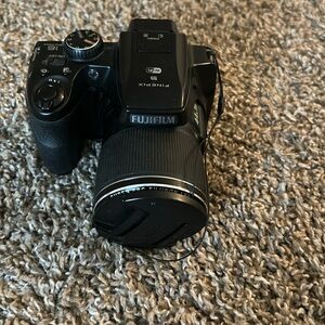 CAMERA Brand:Fuji-film color: Black and it’s digital.